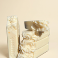 Head in the Clouds handmade soap bars on a warm ivory background
