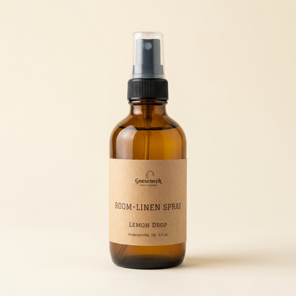 Linen & Room Spray amber bottle on a warm ivory background