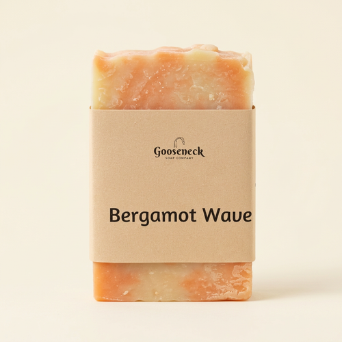Bergamot Wave soap with its paper label on a warm ivory background